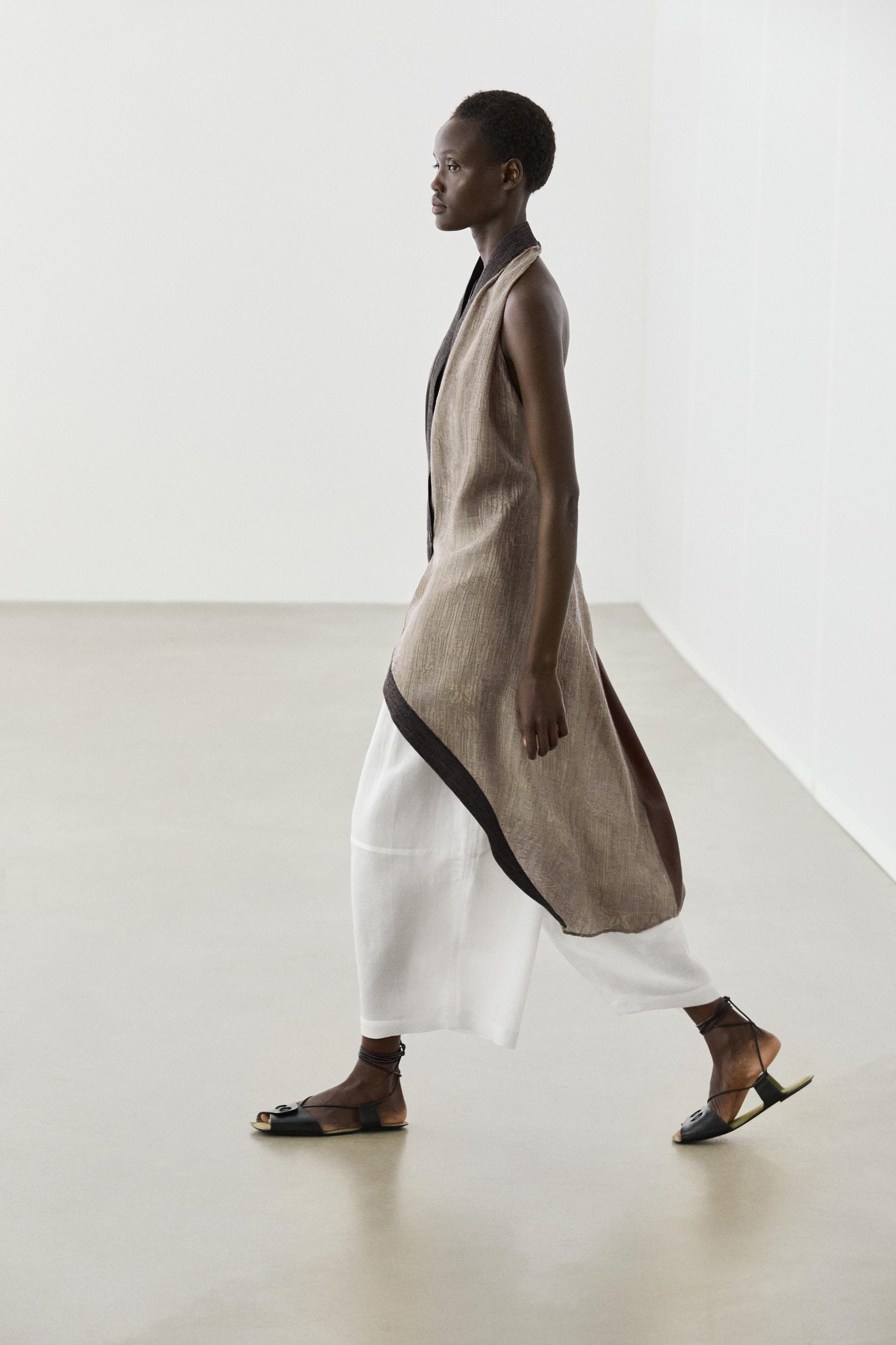 Flowing wrap top with mixed fabric detail